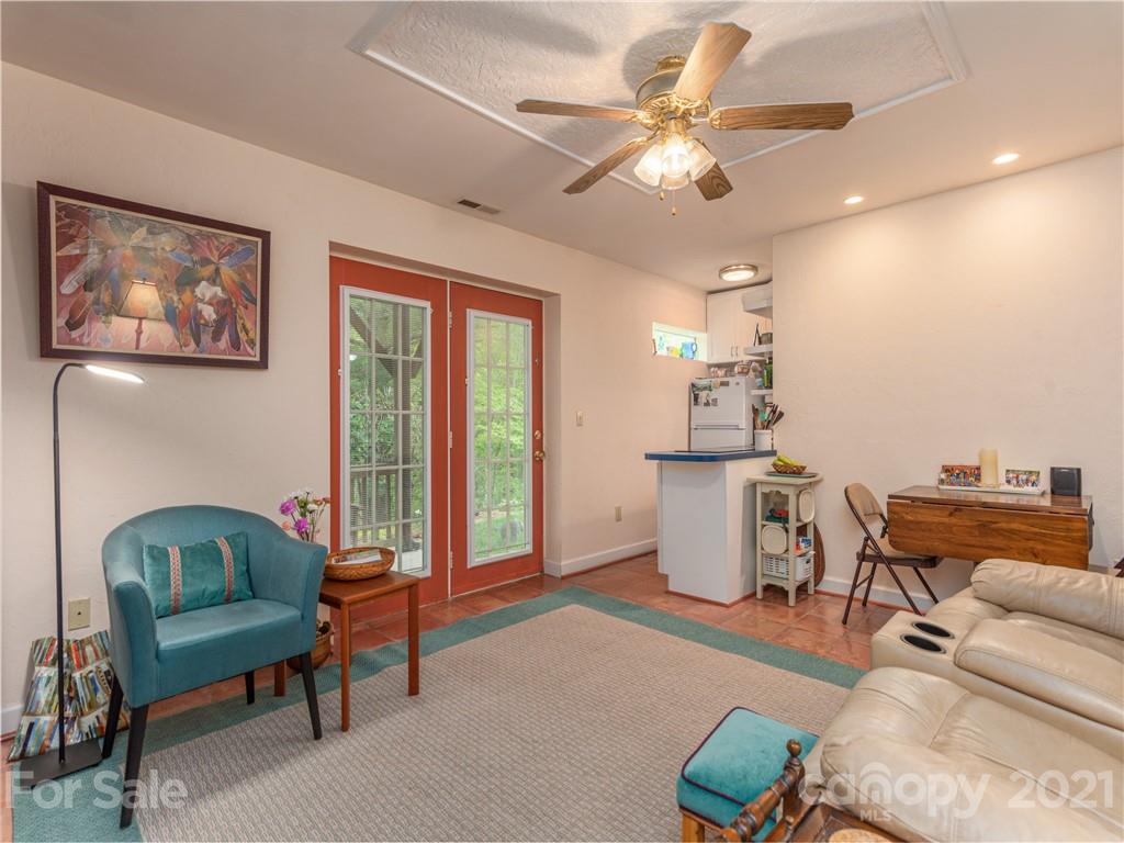 100 Ridgeline Road Clyde, NC 28721 - Photo 17 of 26 a living room with furniture and a large window