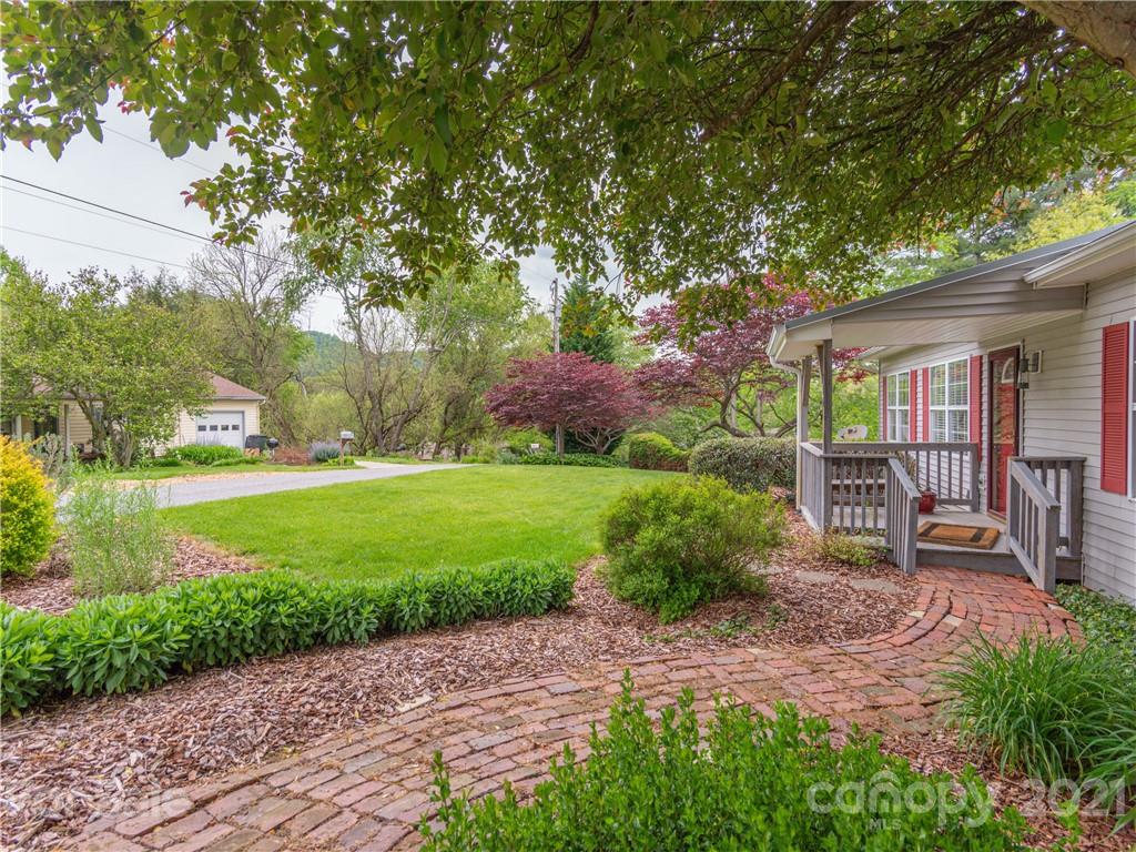 100 Ridgeline Road Clyde, NC 28721 - Photo 3 of 26 a front view of a house with garden