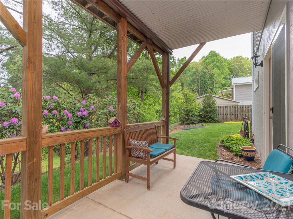 100 Ridgeline Road Clyde, NC 28721 - Photo 21 of 26 a view of a wooden bench in the garden