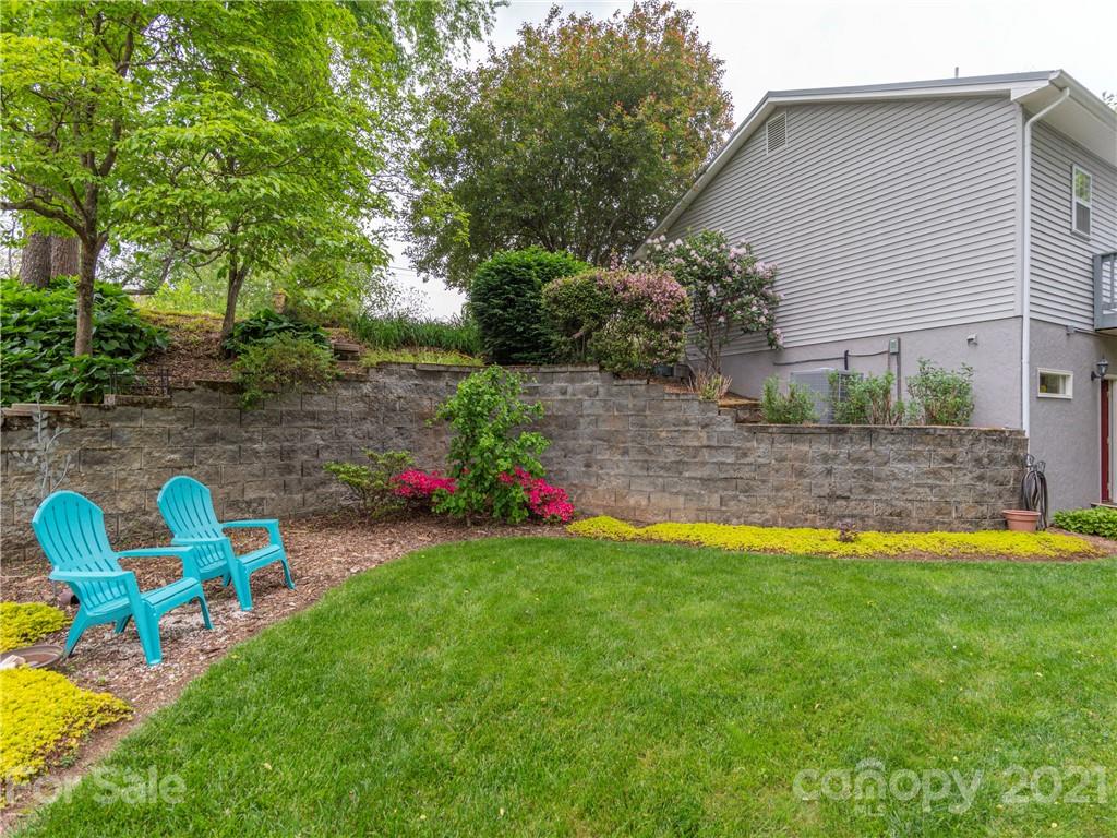 100 Ridgeline Road Clyde, NC 28721 - Photo 24 of 26 a view of a backyard with a slide