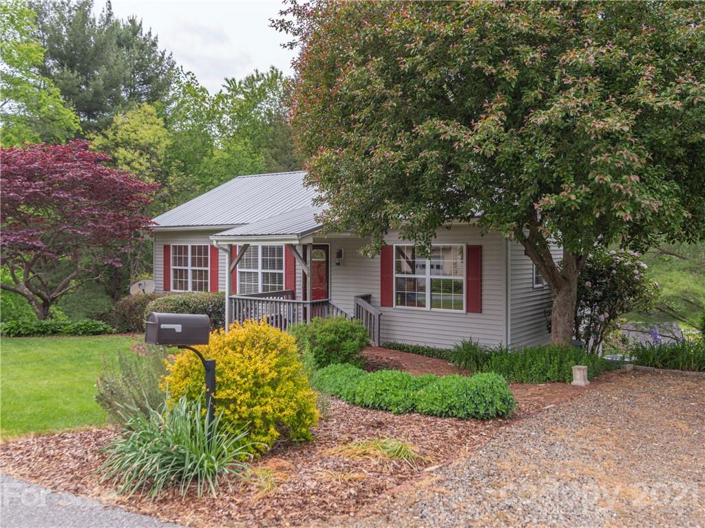 100 Ridgeline Road Clyde, NC 28721 - Photo 26 of 26 a front view of a house with garden