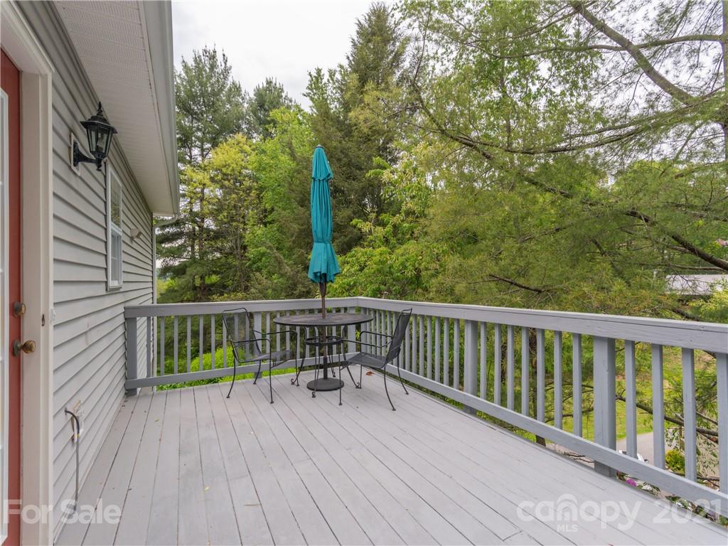 100 Ridgeline Road Clyde, NC 28721 - Photo 8 of 26 a view of balcony with wooden floor and fence