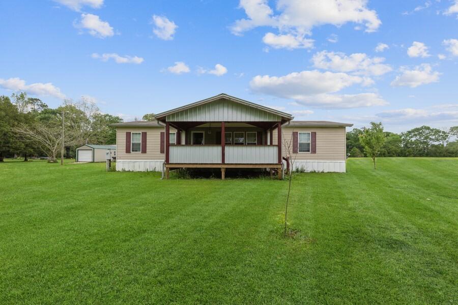 1179 Shady Grove Road Baker, FL 32531 - Photo 2 of 49 a view of a house with a yard porch and sitting area