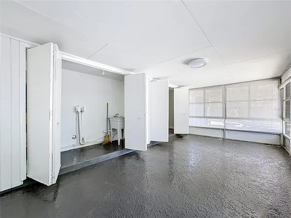 a view of room with window and ceiling fan