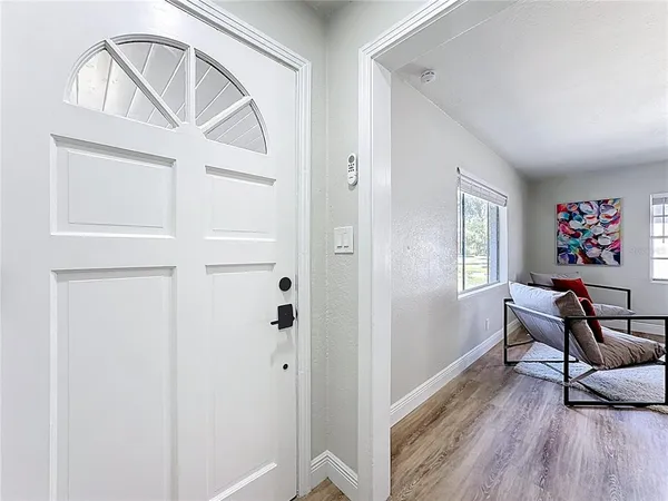 a view of a livingroom with furniture and wooden floor