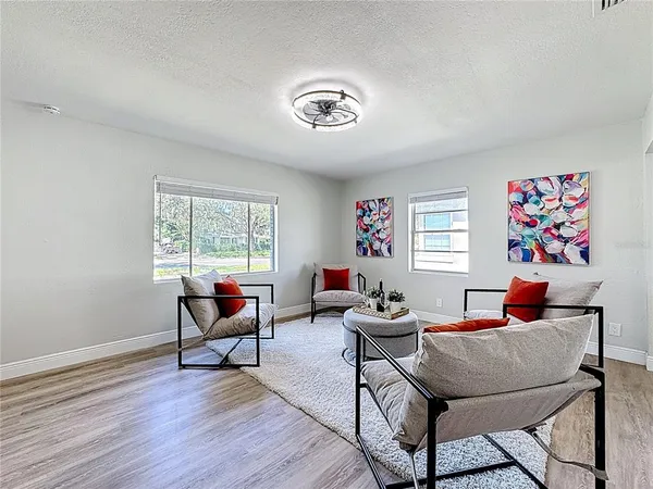a living room with furniture and a window