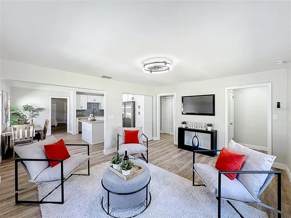 a living room with furniture and a flat screen tv