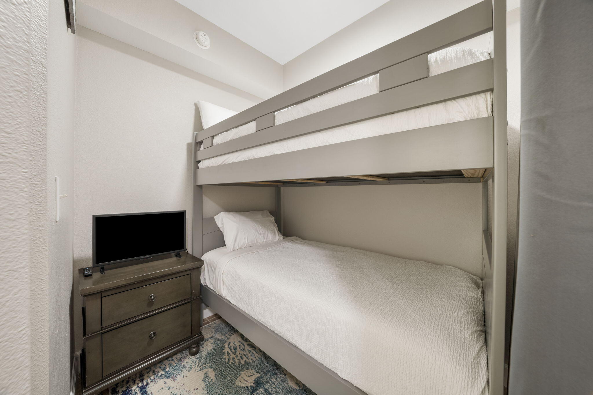 16819 Front Beach Road, Unit 2116 Panama City Beach, FL 32413 - Photo 12 of 51 a bedroom with a bed and a television