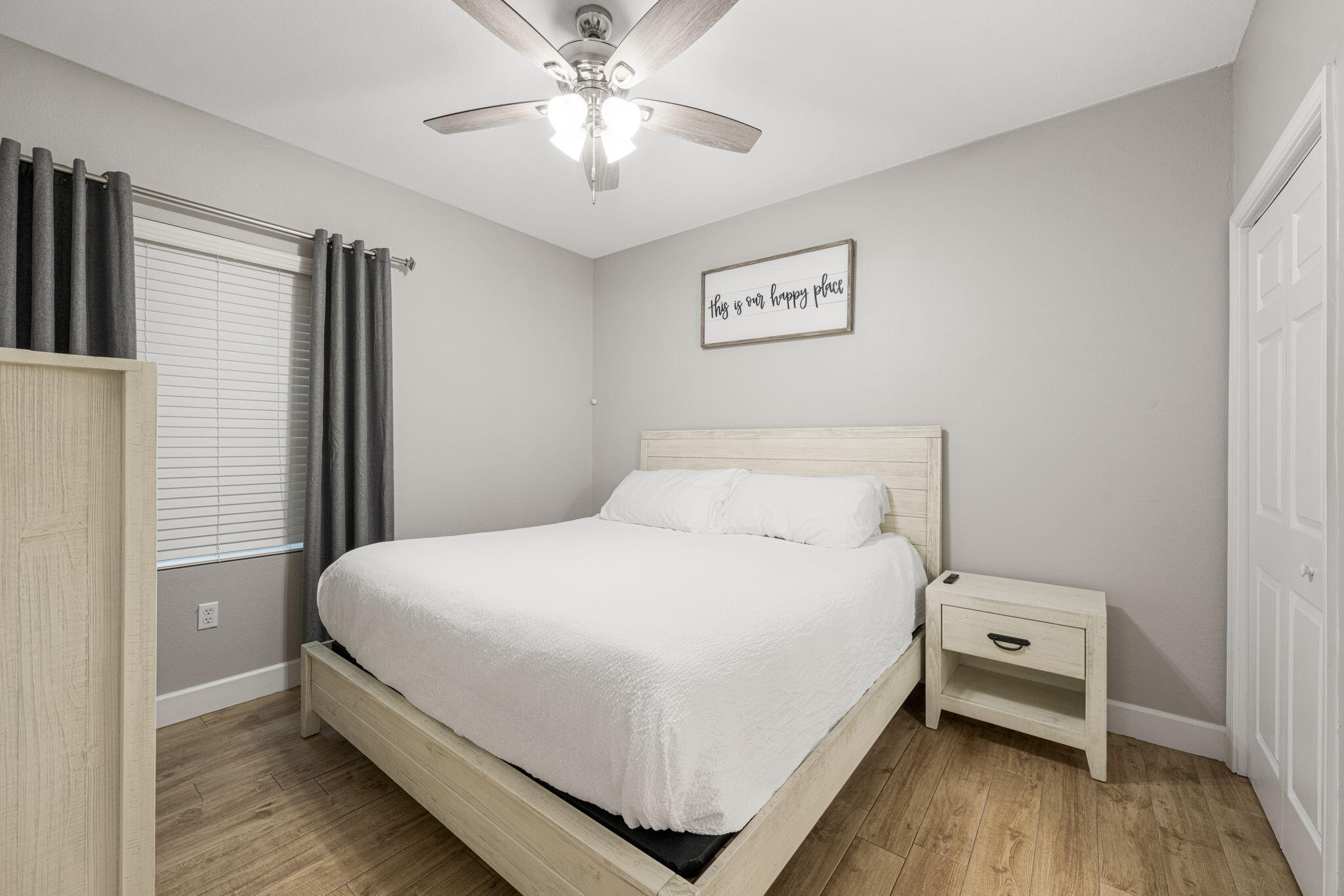 16819 Front Beach Road, Unit 2116 Panama City Beach, FL 32413 - Photo 16 of 51 a bedroom with a bed and a chandelier