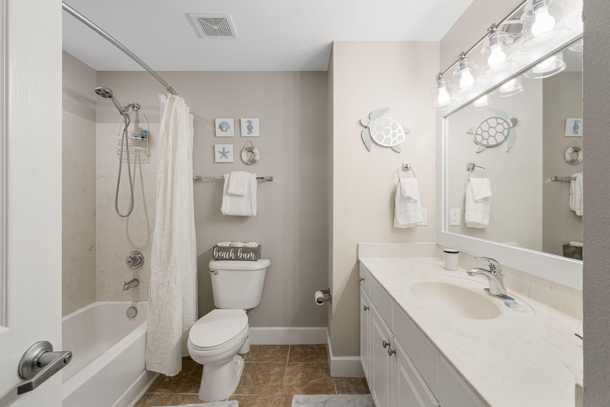 16819 Front Beach Road, Unit 2116 Panama City Beach, FL 32413 - Photo 18 of 51 a bathroom with a sink toilet tub and shower