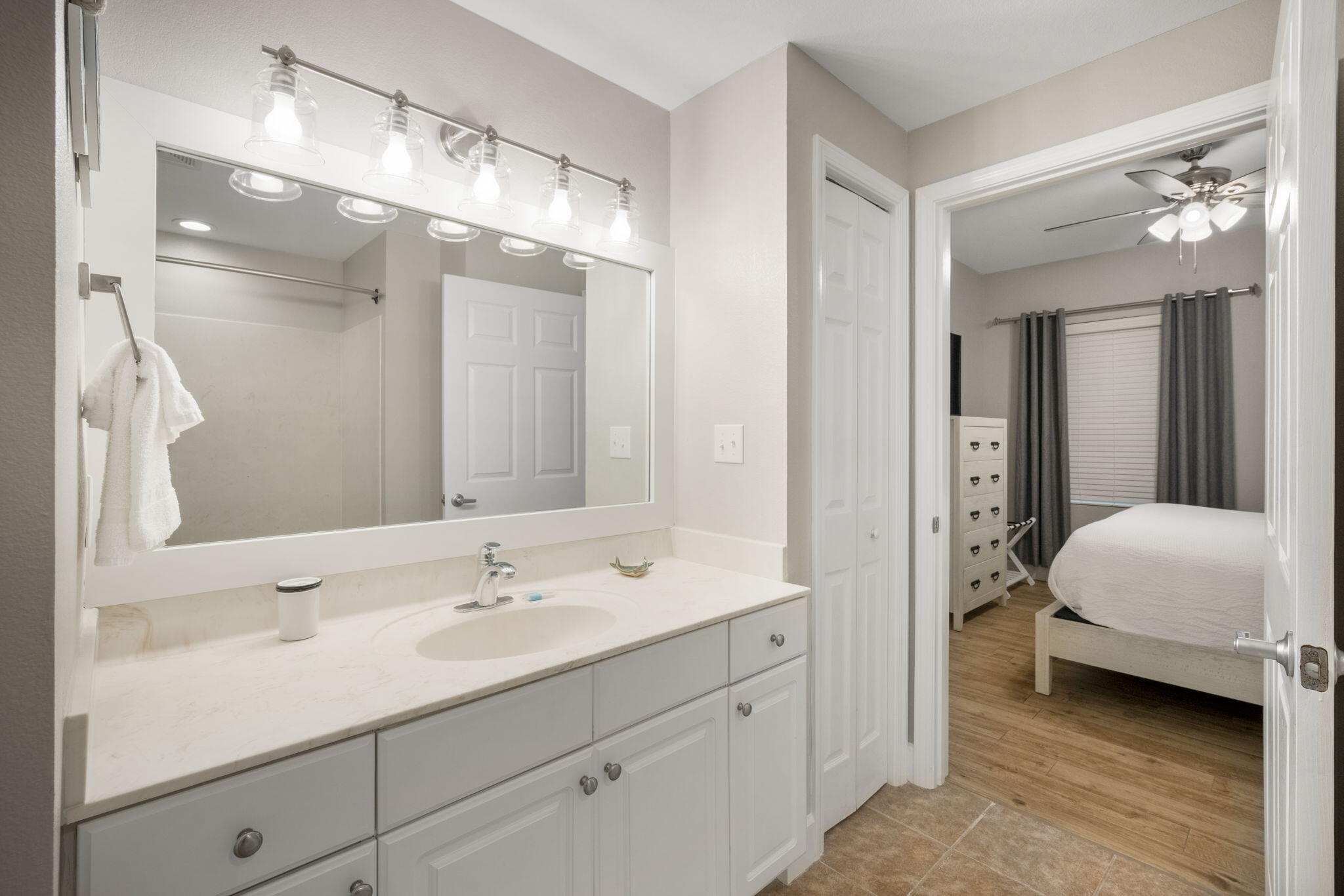 16819 Front Beach Road, Unit 2116 Panama City Beach, FL 32413 - Photo 19 of 51 a en suite bathroom with a double vanity sink and a mirror