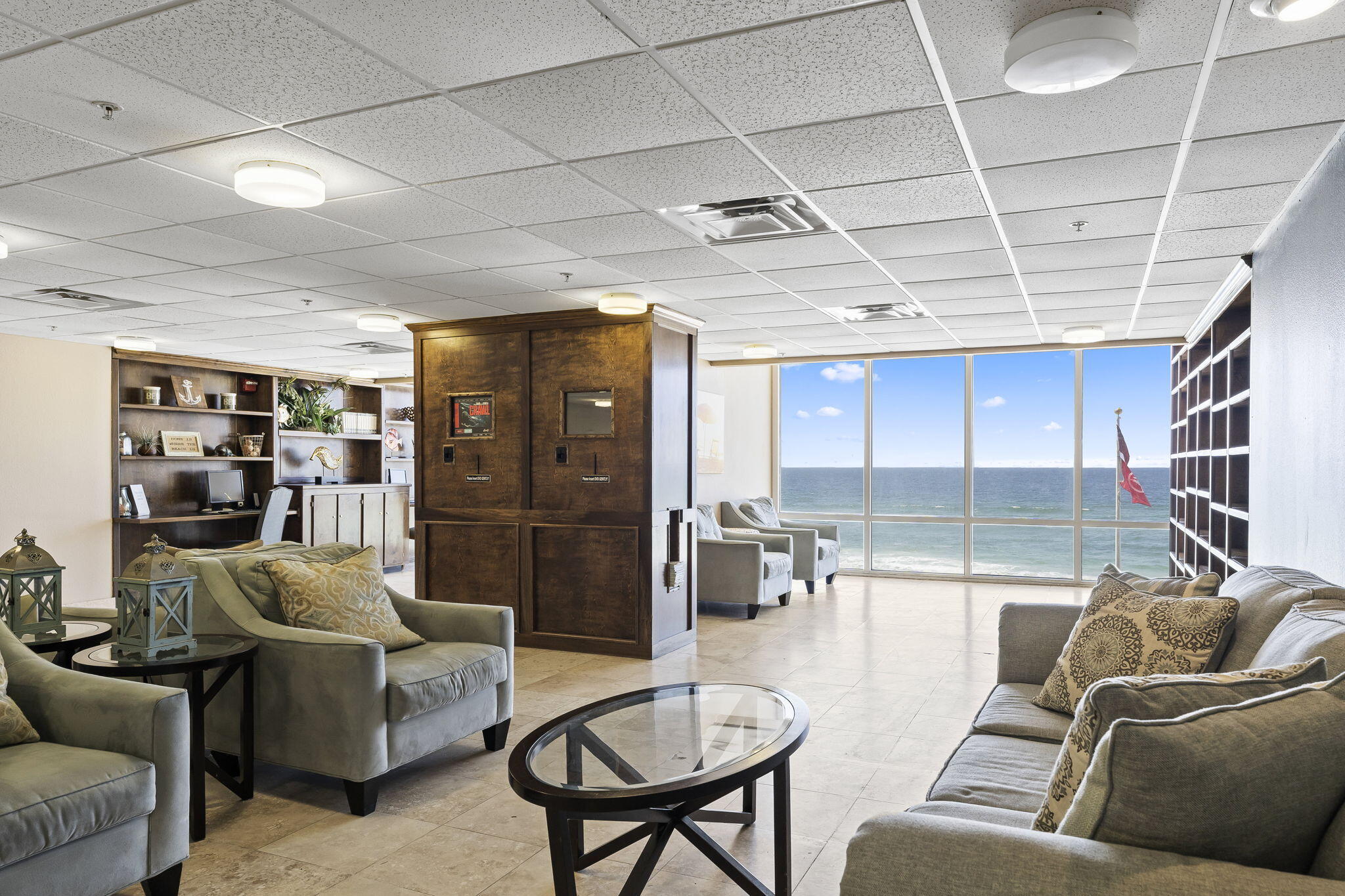 16819 Front Beach Road, Unit 2116 Panama City Beach, FL 32413 - Photo 33 of 51 a living room with furniture and a glass door shower