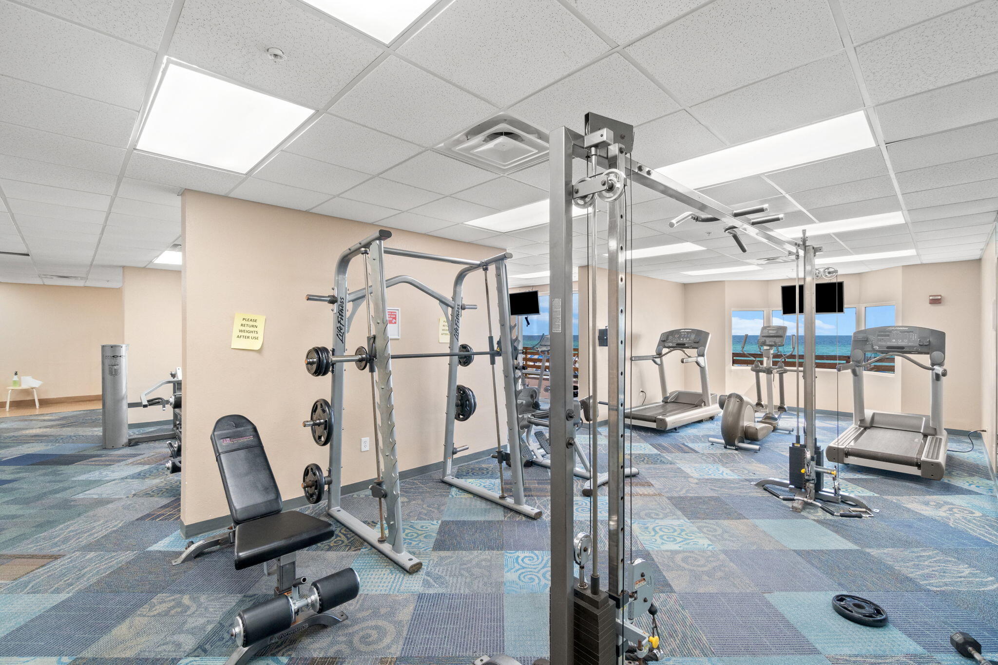 16819 Front Beach Road, Unit 2116 Panama City Beach, FL 32413 - Photo 36 of 51 a view of a room with gym equipment