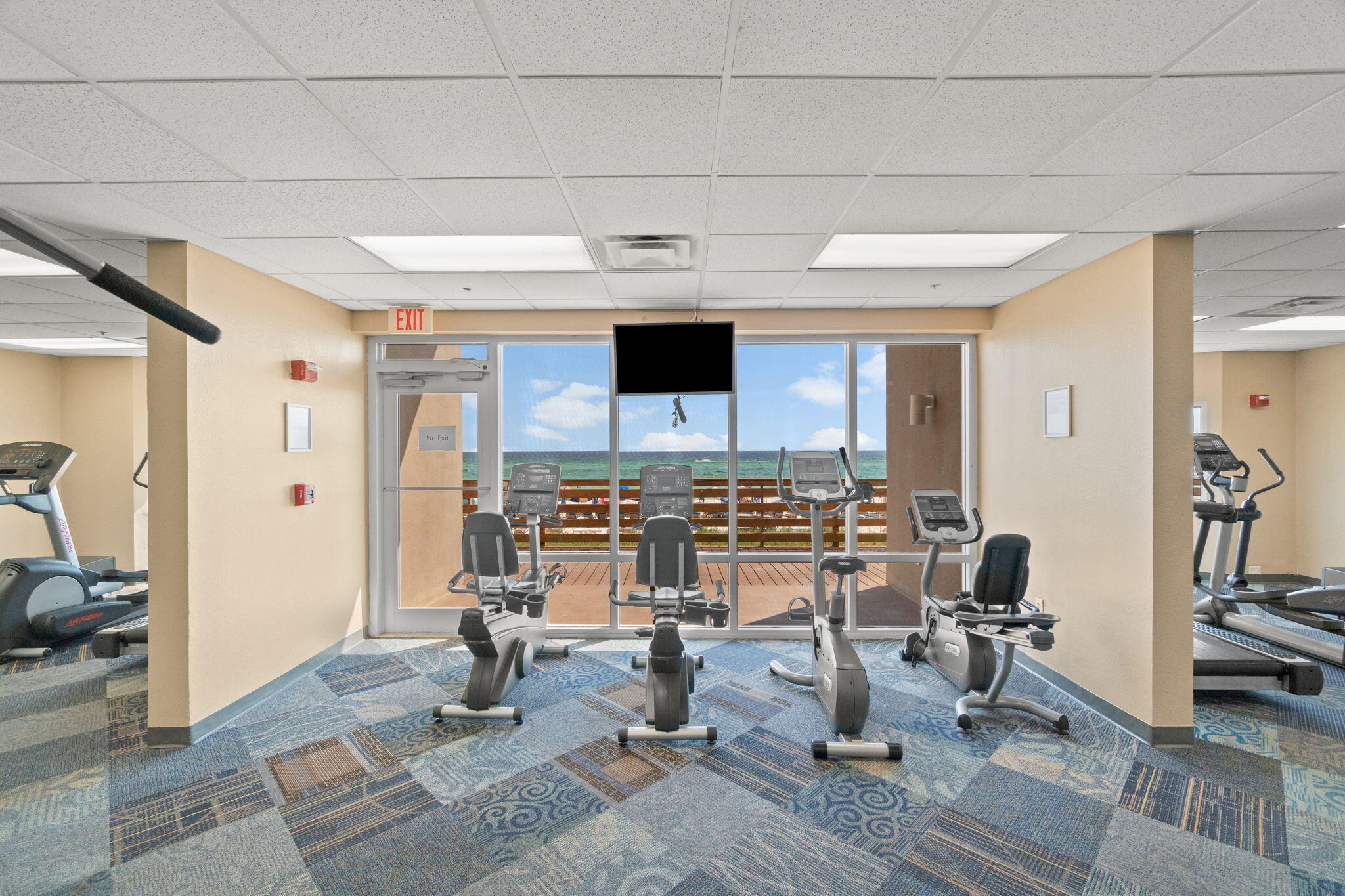 16819 Front Beach Road, Unit 2116 Panama City Beach, FL 32413 - Photo 38 of 51 a view of a livingroom with chairs and a fireplace