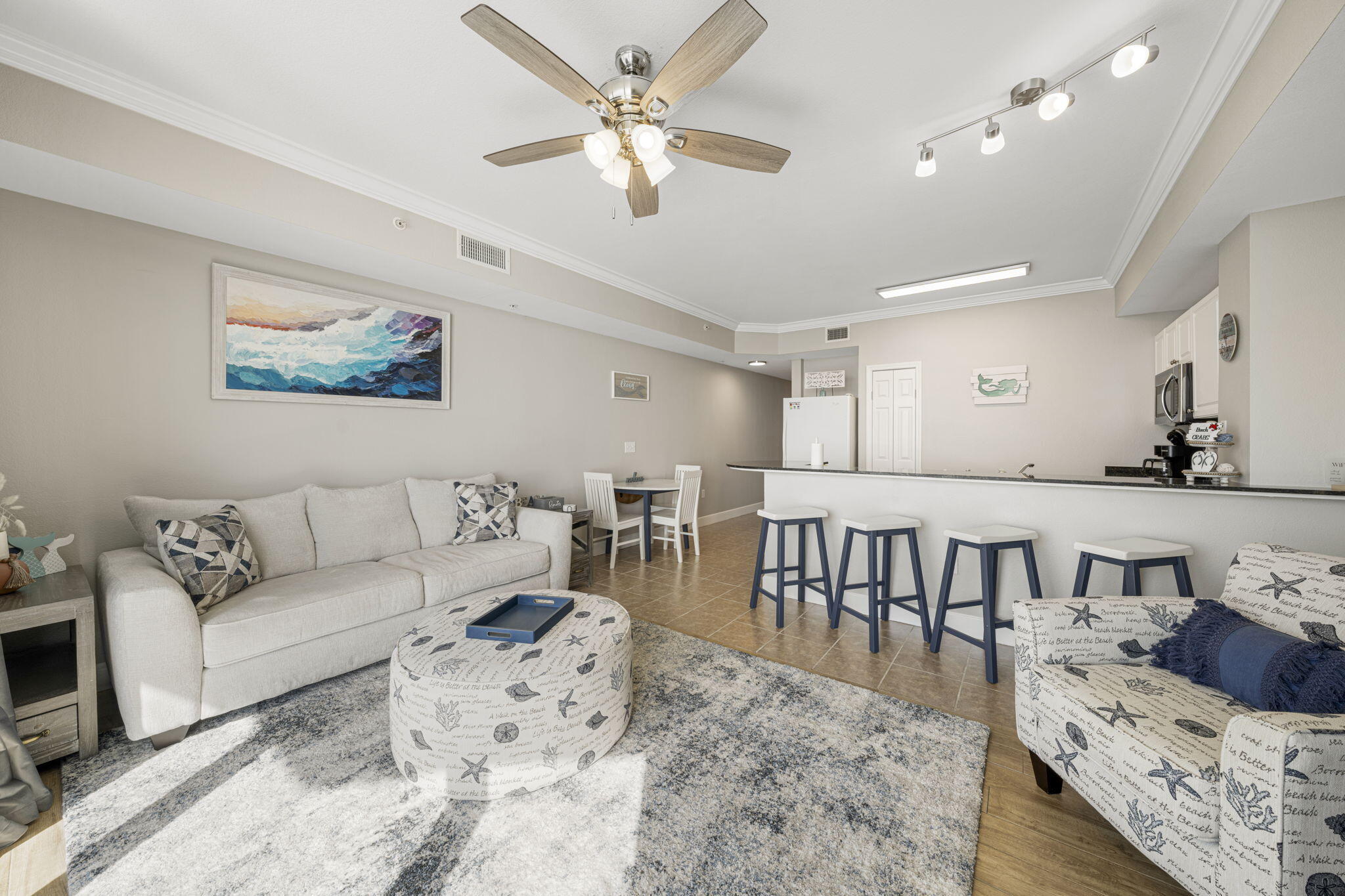 16819 Front Beach Road, Unit 2116 Panama City Beach, FL 32413 - Photo 5 of 51 a living room with furniture and a couch