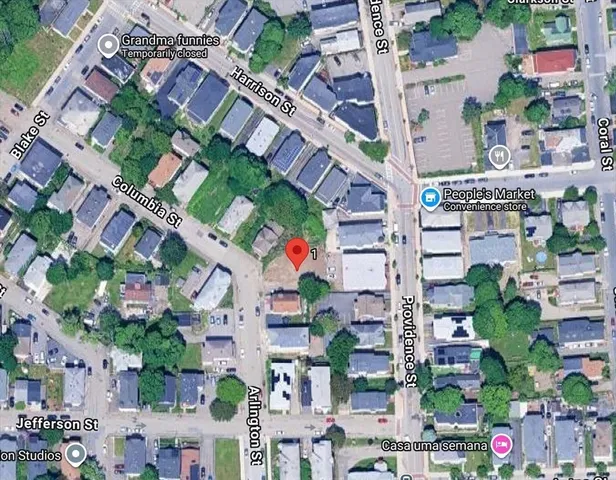 an aerial view of residential houses with outdoor space