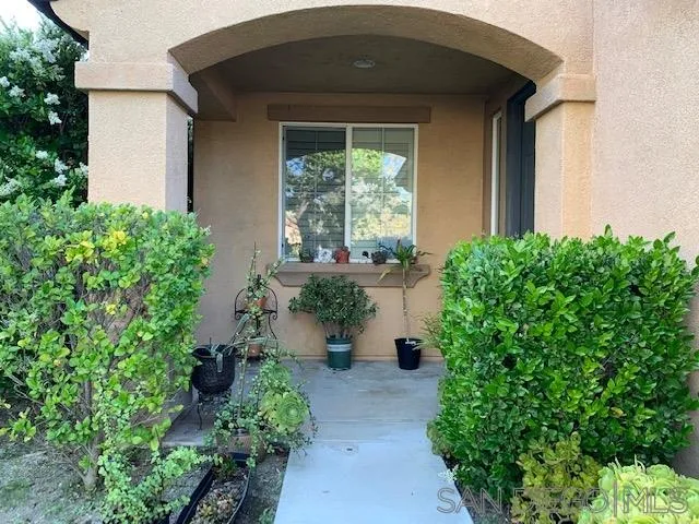 38325 Encanto Road Murrieta, CA 92563 - Photo 2 of 17 a front view of a house with a yard