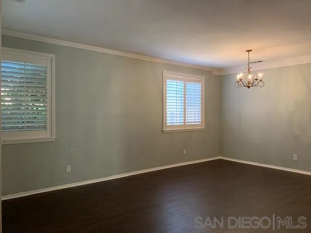 38325 Encanto Road Murrieta, CA 92563 - Photo 3 of 17 a view of empty room with wooden floor and fan