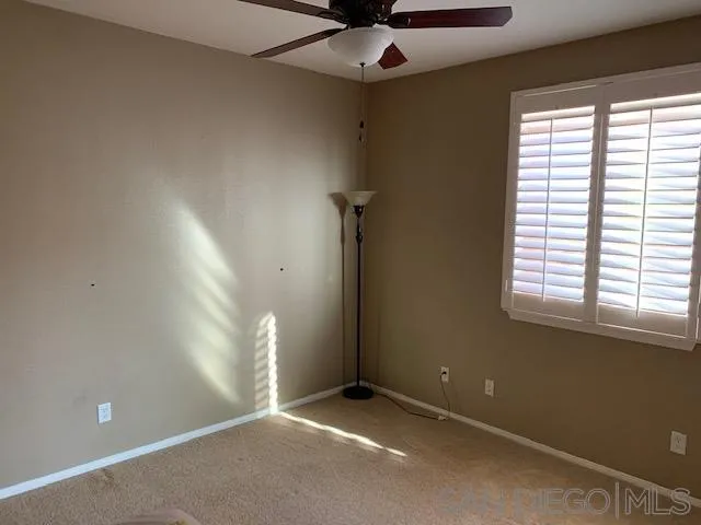 38325 Encanto Road Murrieta, CA 92563 - Photo 8 of 17 a view of an empty room with a window