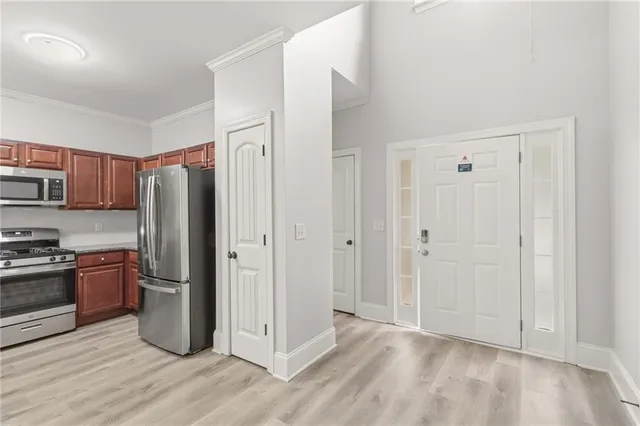 a bedroom with a bed and a potted plant