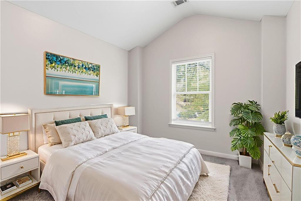 199 Mount Moriah Road Ball Ground, GA 30107 - Photo 16 of 39 a bedroom with a bed and a potted plant