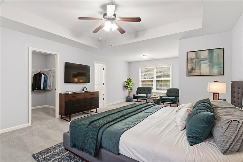 199 Mount Moriah Road Ball Ground, GA 30107 - Photo 20 of 39 a bedroom with a bed and a flat screen tv