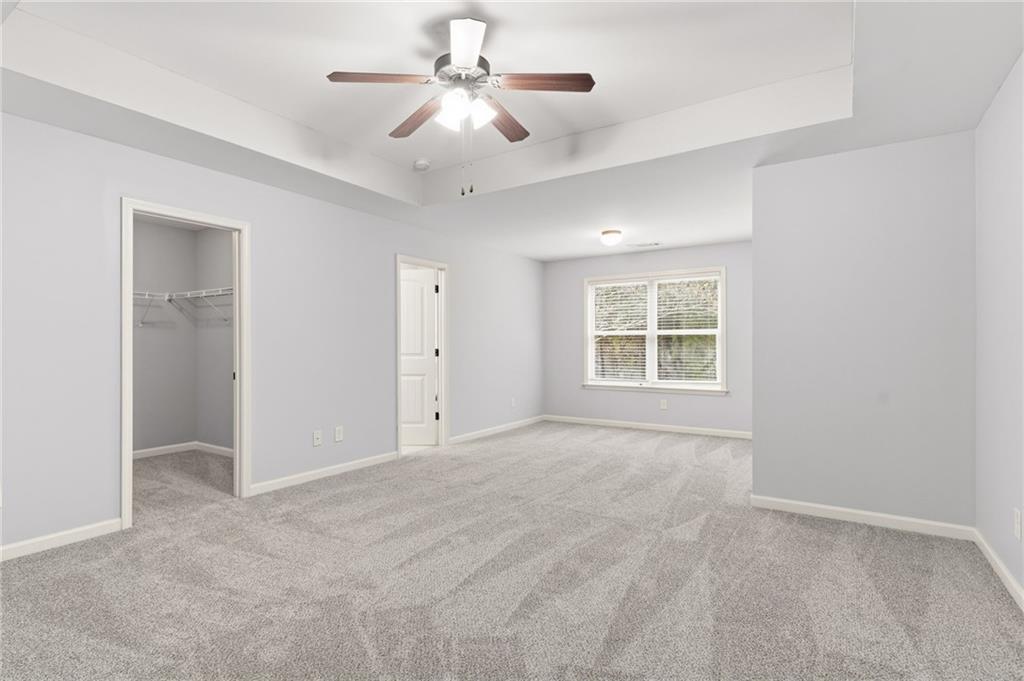 199 Mount Moriah Road Ball Ground, GA 30107 - Photo 21 of 39 a view of an empty room with a window