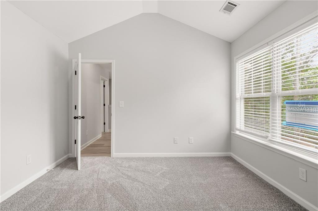 199 Mount Moriah Road Ball Ground, GA 30107 - Photo 23 of 39 an empty room with a window