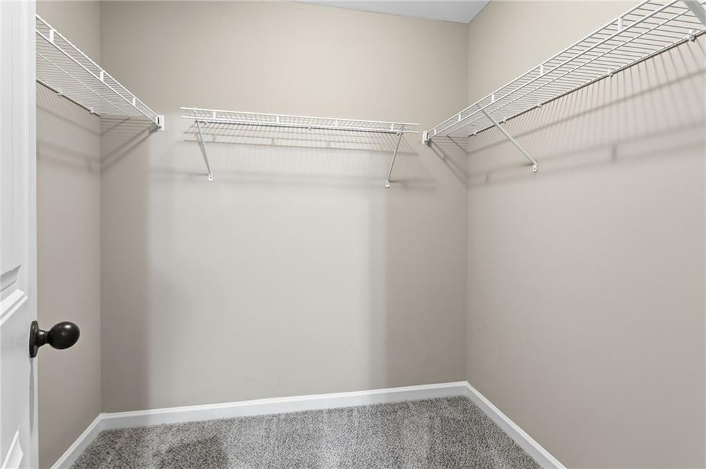 199 Mount Moriah Road Ball Ground, GA 30107 - Photo 32 of 39 a view of a room with racks on the wall