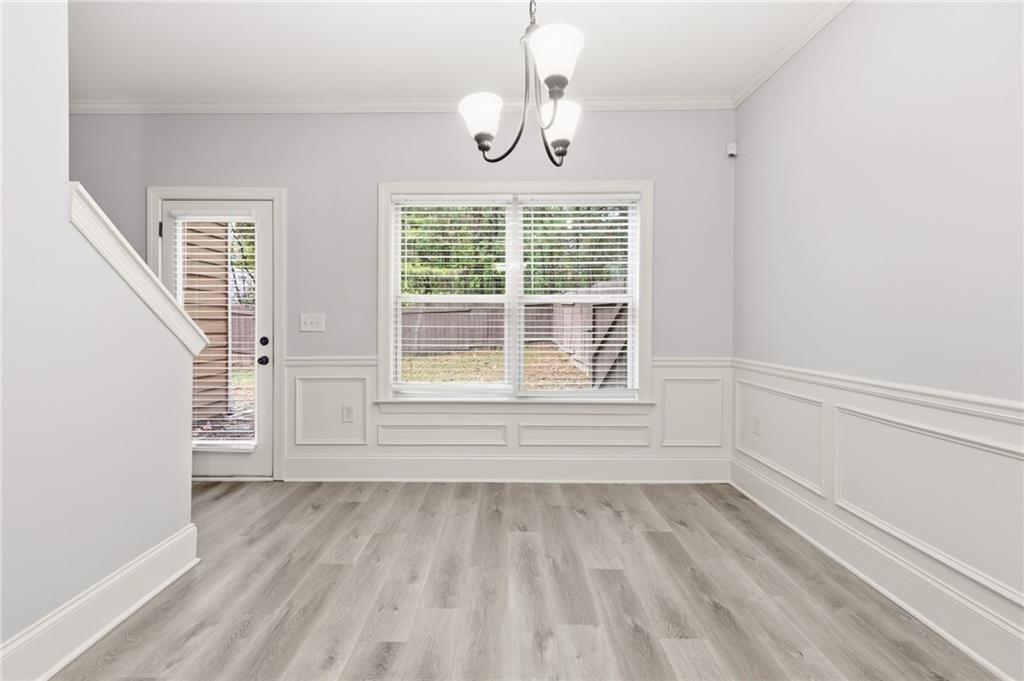 199 Mount Moriah Road Ball Ground, GA 30107 - Photo 6 of 39 a view of empty room with wooden floor and fan