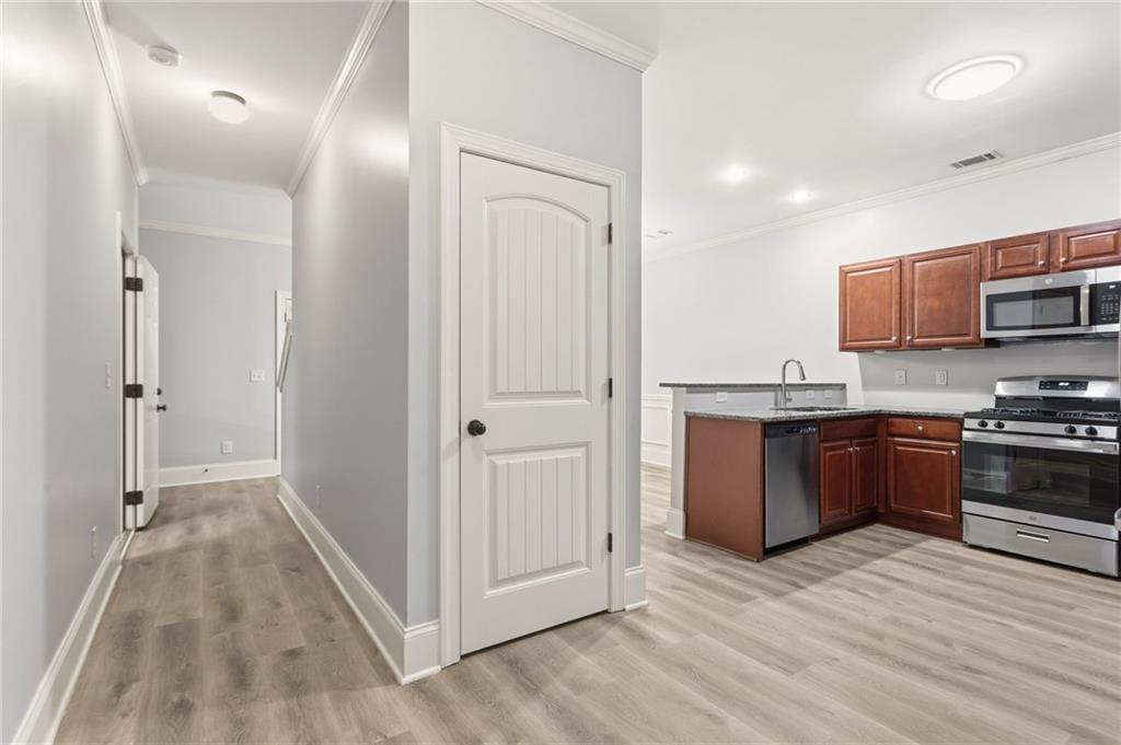 199 Mount Moriah Road Ball Ground, GA 30107 - Photo 8 of 39 a kitchen with stainless steel appliances granite countertop a refrigerator and a stove