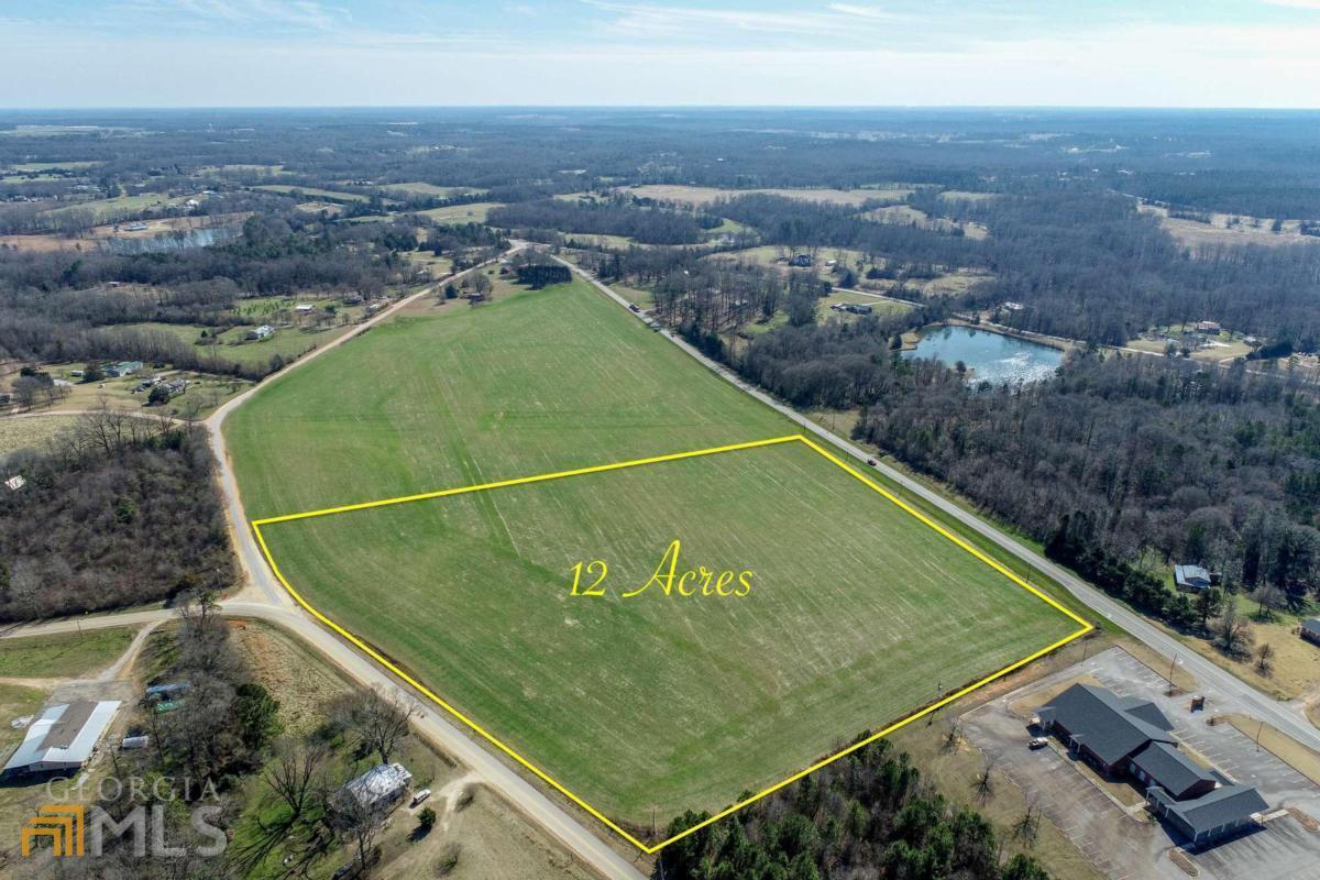 451 Racetrack Road Danielsville, GA 30633 - Photo 1 of 1 an aerial view of a tennis court