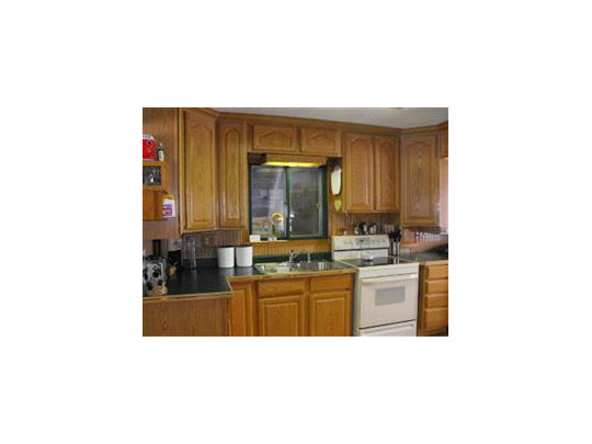 7823 West Mill Pond Road Beloit, WI 53511 - Photo 3 of 11 a kitchen with stainless steel appliances a sink and cabinets