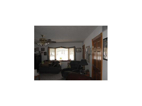 7823 West Mill Pond Road Beloit, WI 53511 - Photo 8 of 11 a living room with furniture and windows
