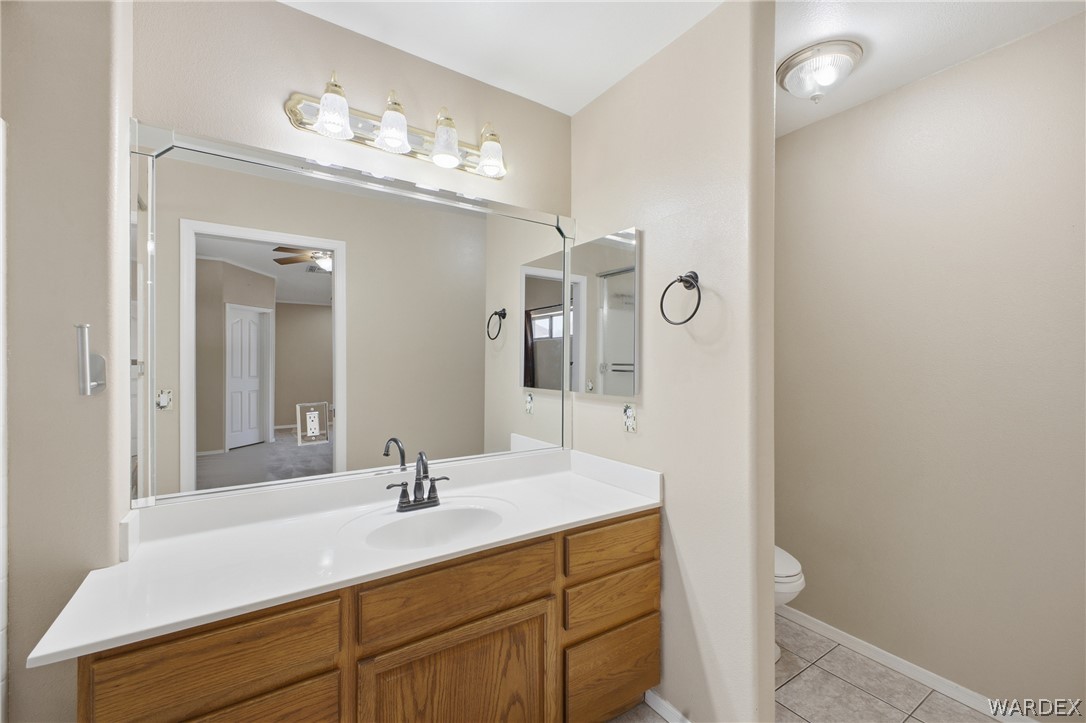 3918 North Eagle Rock Road Kingman, AZ 86409 - Photo 27 of 44 a bathroom with a sink vanity and mirror