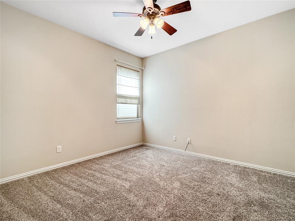 401 Varnum Way Fairview, TX 75069 - Photo 23 of 33 an empty room with fan and windows