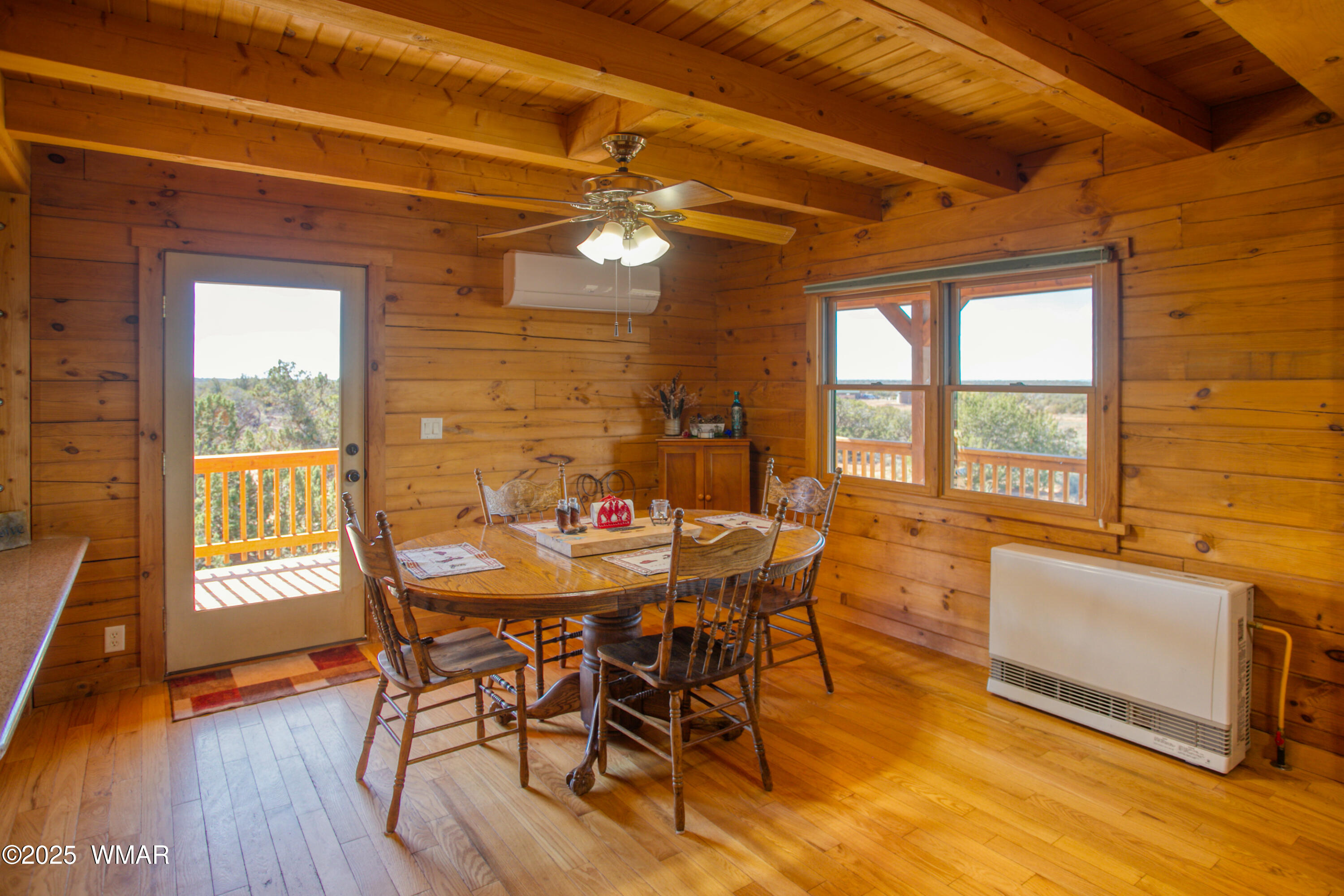 8555 Reata Lane Snowflake, AZ 85937 - Photo 18 of 88 a view of a dining room with furniture window and wooden floor