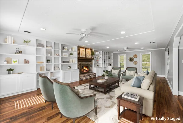 a kitchen with stainless steel appliances granite countertop a stove top oven a sink dishwasher and a refrigerator