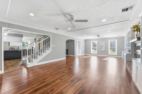 a view of livingroom with hardwood floor and ceiling fan