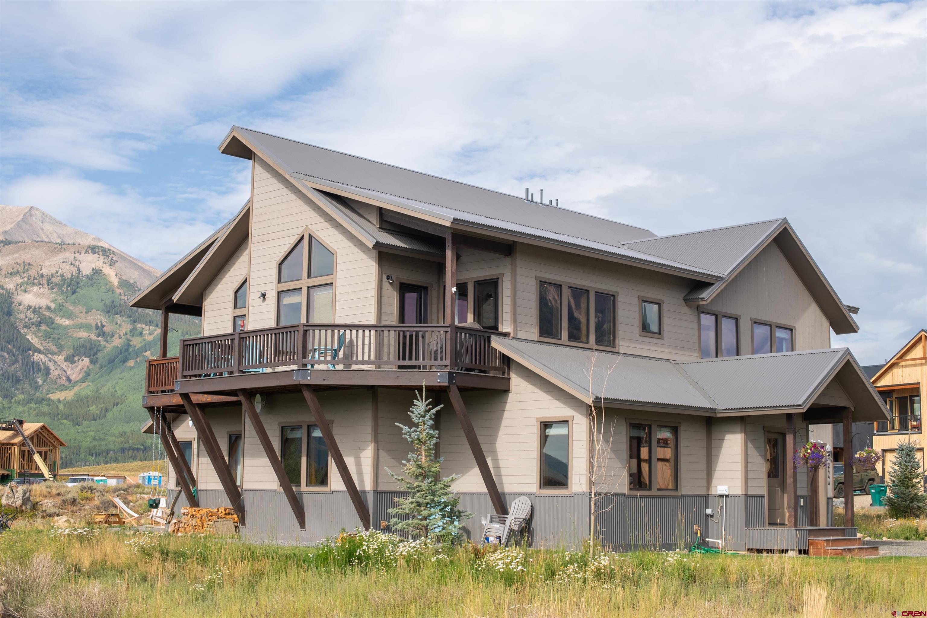 244 Elk Valley Road, Unit A Crested Butte, CO 81224 - Photo 6 of 35 a aerial view of a house with swimming pool and porch