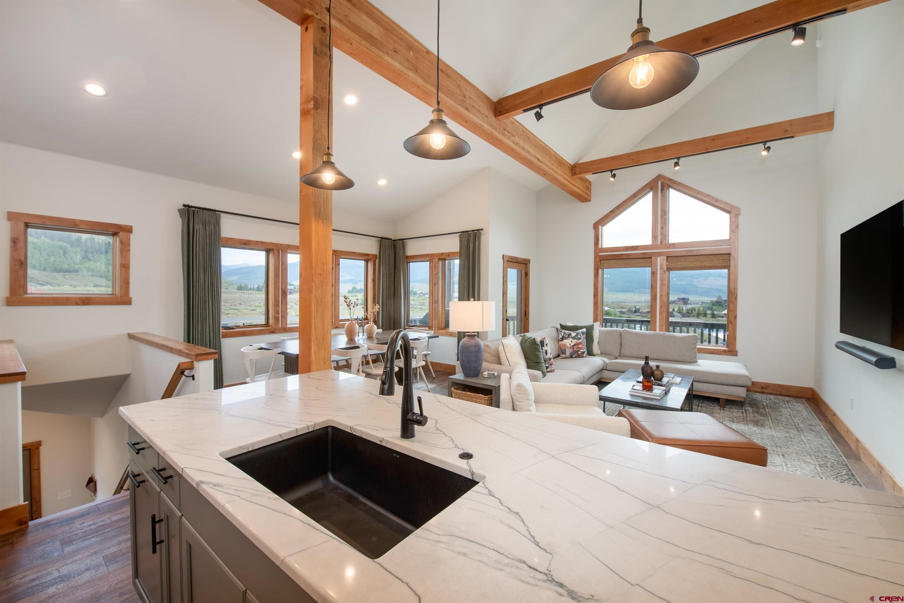 244 Elk Valley Road, Unit A Crested Butte, CO 81224 - Photo 35 of 35 a living room with stainless steel appliances kitchen island furniture and a large window