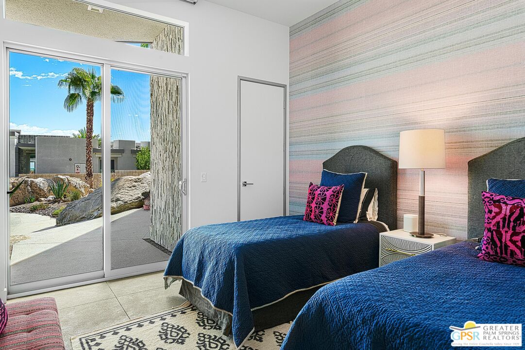 775 South La Mirada Road Palm Springs, CA 92264 - Photo 28 of 59 a bedroom with two beds and a table