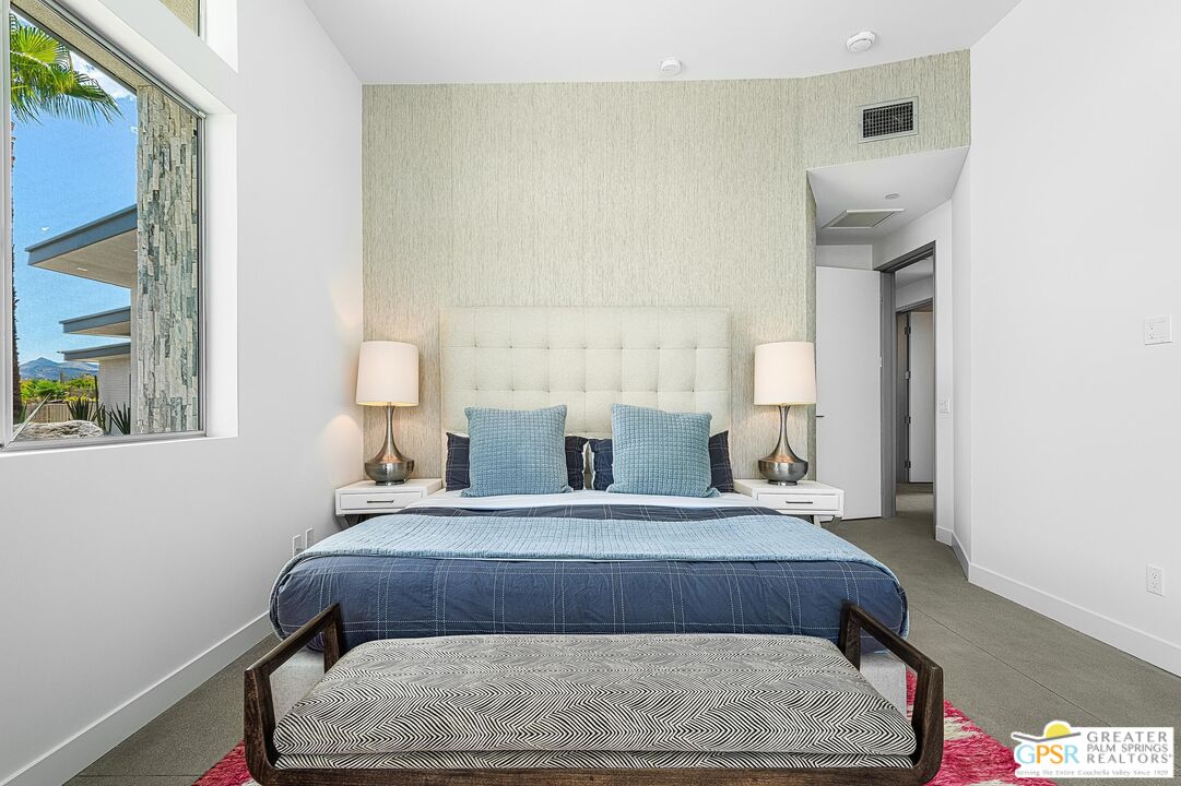775 South La Mirada Road Palm Springs, CA 92264 - Photo 29 of 59 a bedroom with a bed and a lamp with window