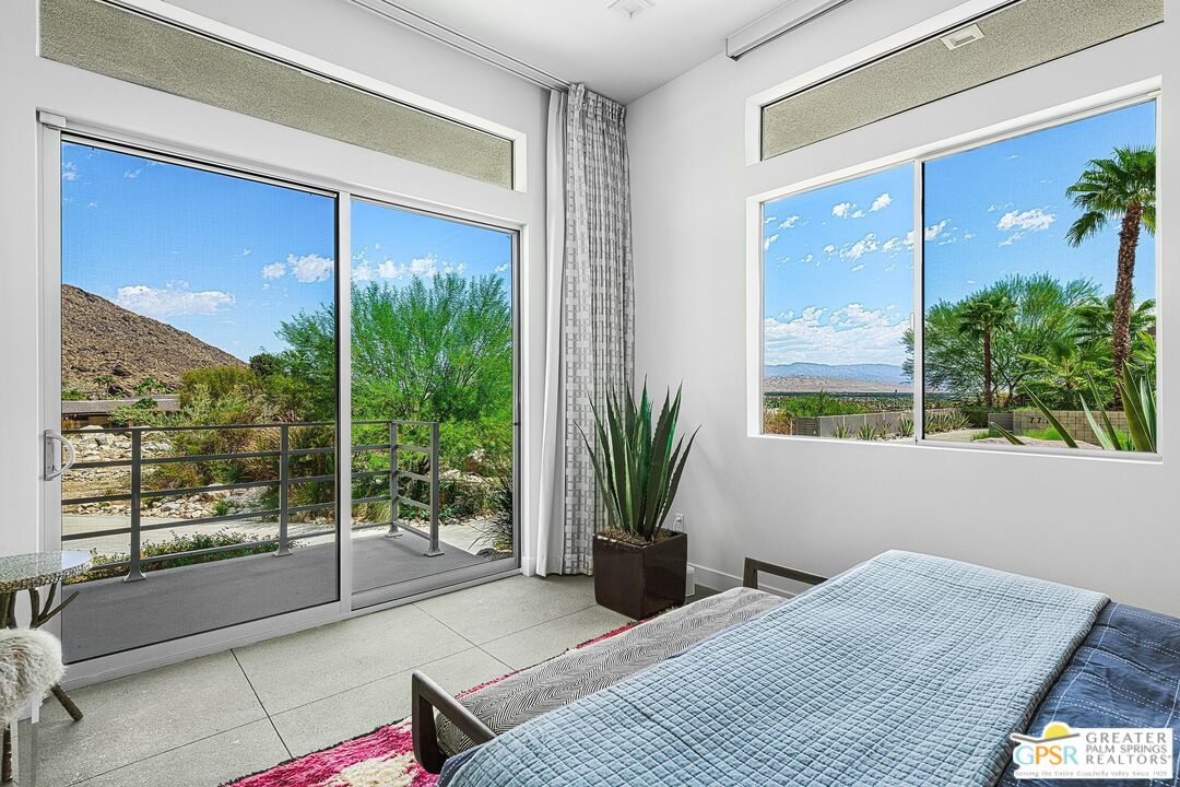 775 South La Mirada Road Palm Springs, CA 92264 - Photo 30 of 59 a bedroom with a large window and bed