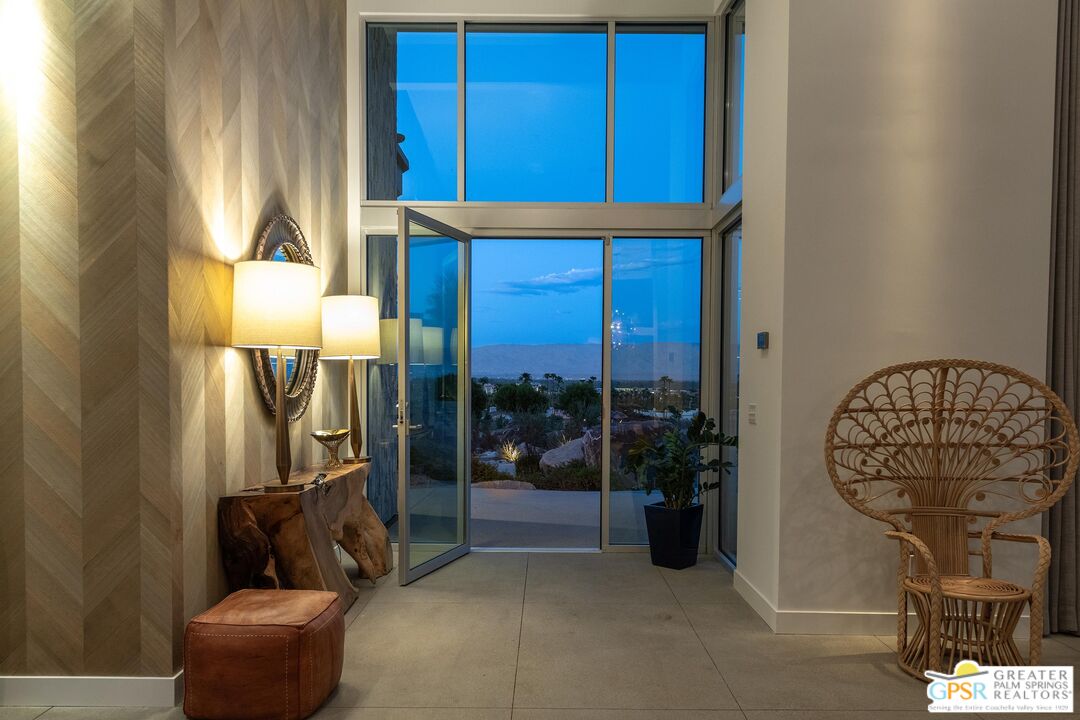 775 South La Mirada Road Palm Springs, CA 92264 - Photo 41 of 59 a living room with a couch and a potted plant