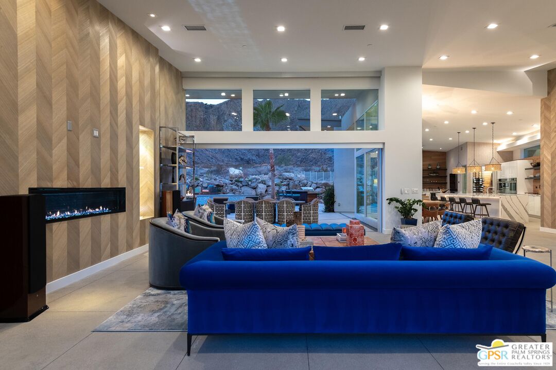 775 South La Mirada Road Palm Springs, CA 92264 - Photo 42 of 59 a living room with furniture and a fireplace