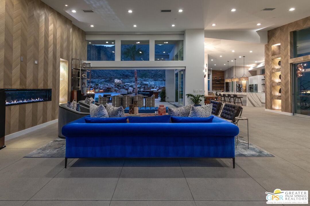 775 South La Mirada Road Palm Springs, CA 92264 - Photo 43 of 59 a living room with furniture and a fireplace