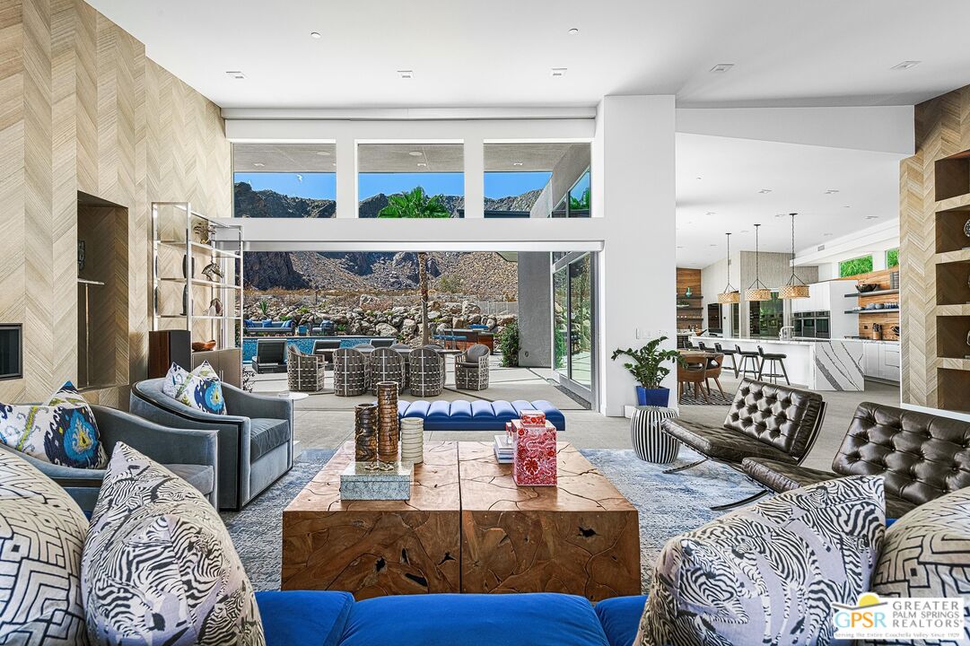 775 South La Mirada Road Palm Springs, CA 92264 - Photo 8 of 59 a living room with furniture fireplace and a fireplace