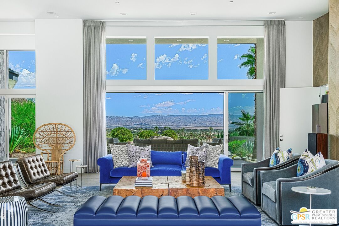775 South La Mirada Road Palm Springs, CA 92264 - Photo 9 of 59 a living room with furniture fireplace and a large window