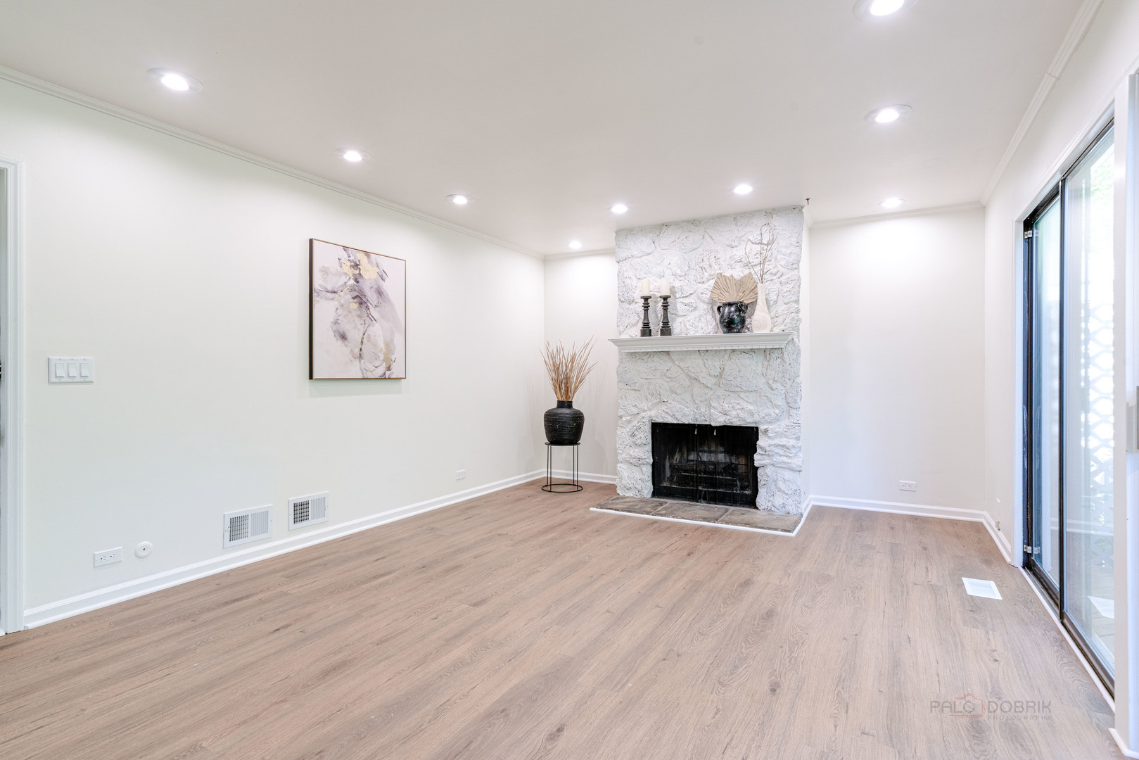 887 Saybrook Lane Buffalo Grove, IL 60089 - Photo 12 of 28 a view of a livingroom with a fireplace wooden floor and window
